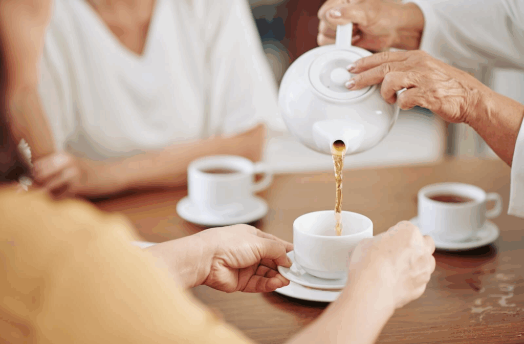 A group of friends share some healthy herbal tea together.