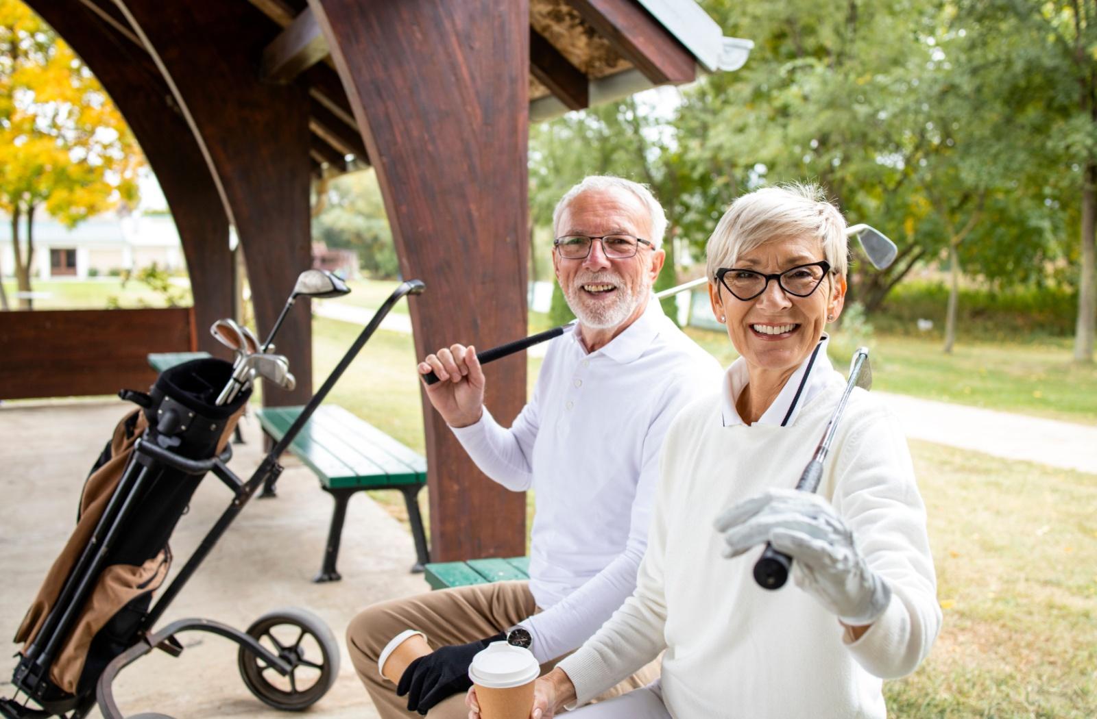 two seniors at a golf course

